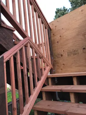Structural deck framing support stairs under deck