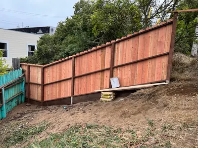 Redwood Privacy Fencing Install on Sloped Yard